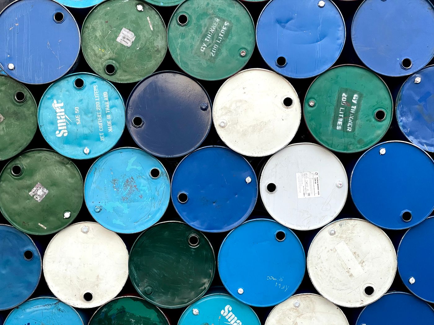 Rows of industrial steel oil drums photographed from above